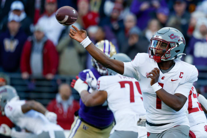 Nov 25, 2023; Seattle, Washington, USA; Washington State Cougars quarterback Cameron Ward (1) passes against the Washington Huskies during the first quarter at Alaska Airlines Field at Husky Stadium.